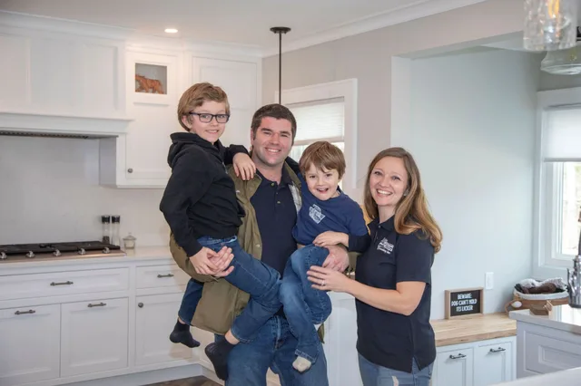 The Reither family in a kitchen they built