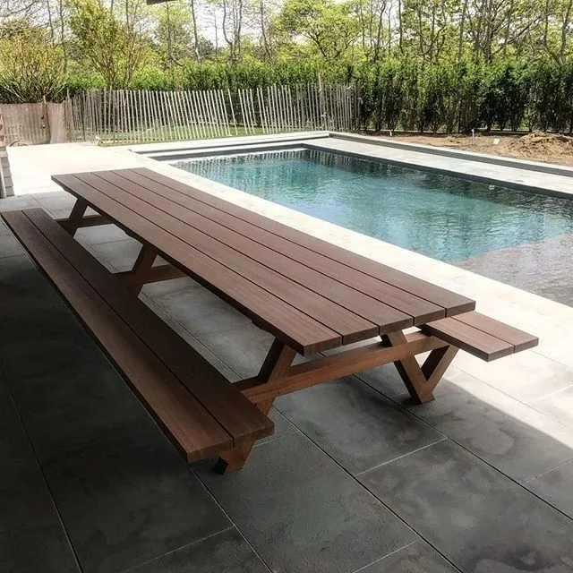 long outdoor picnic table beside pool, Built-Ins & Furniture